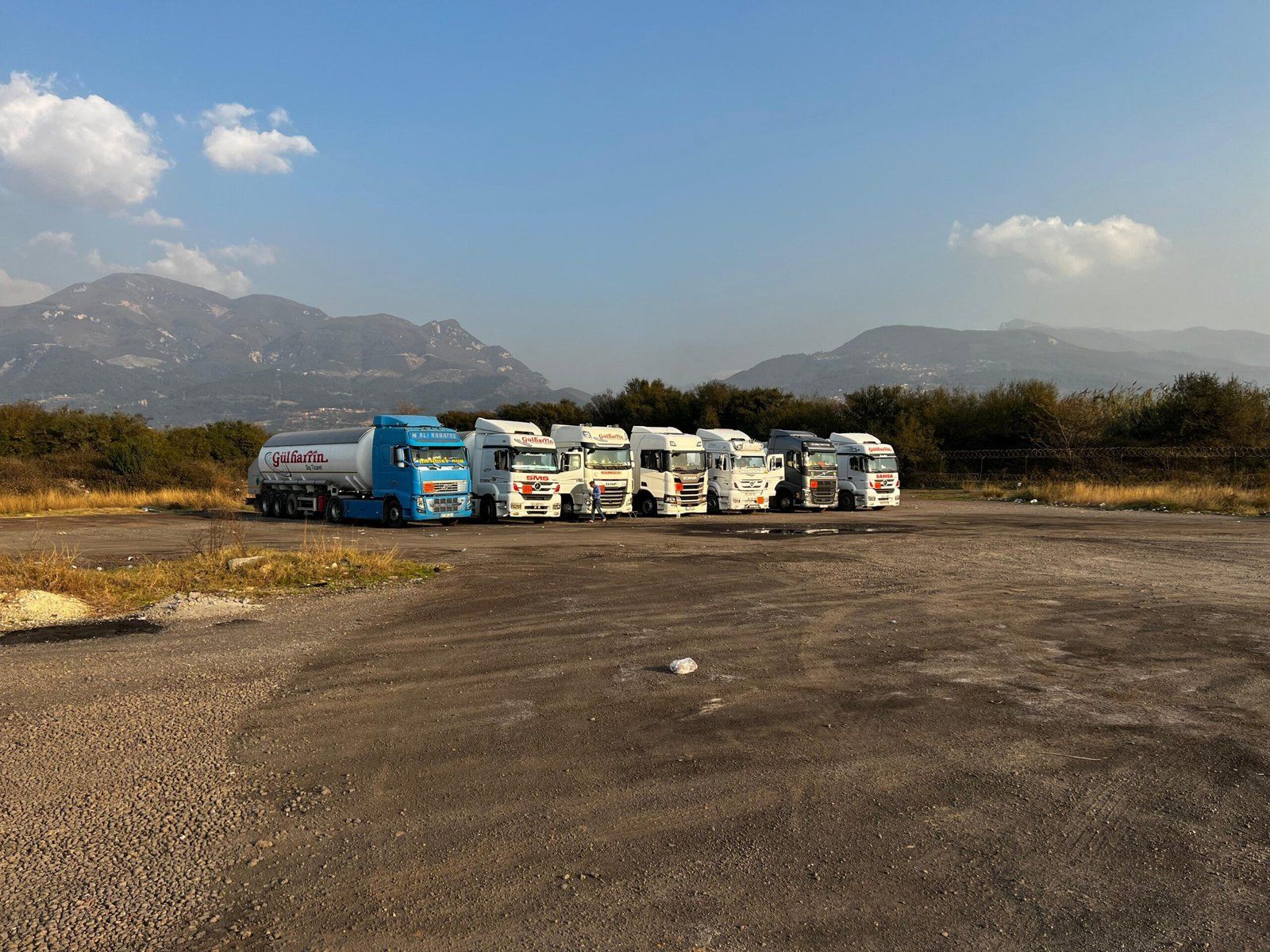 Gülharrin trucks and tanker trailers lined up in the company yard