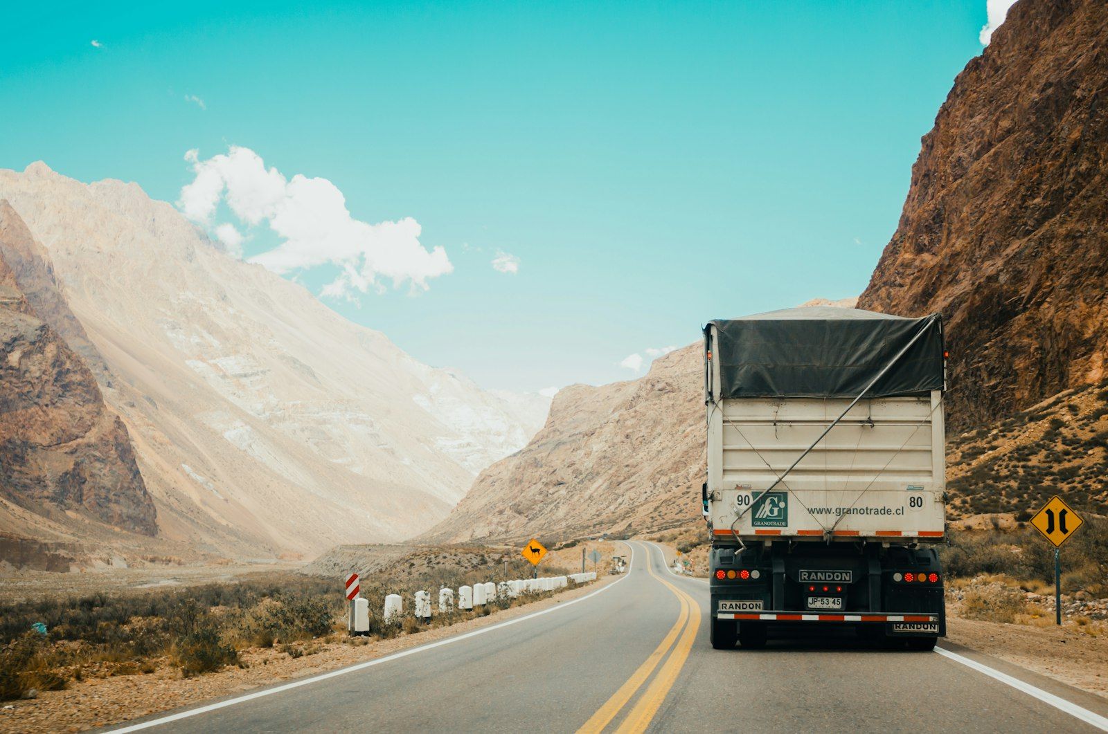 Freight truck climbing a mountain pass road